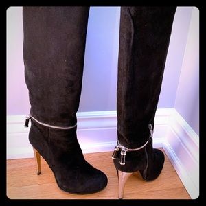 Tall black suede boots.